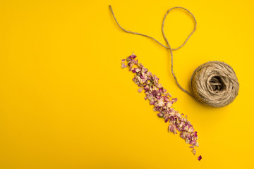 twine and dry rose petals - Powered by Adobe