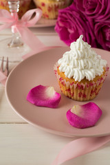 Sweet romantic cupcakes for Valentine's Day on a white wooden background. Selective focus