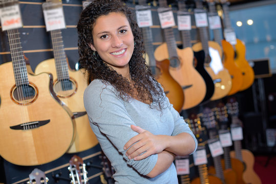 Portrait of woman in guitar shop