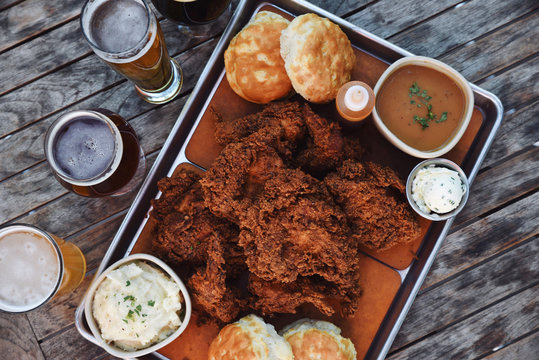 Platter of deep fried meat, sauce and ale 