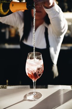 Waitress pouring champagne