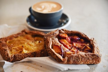 Fruit filled pastries and coffee 