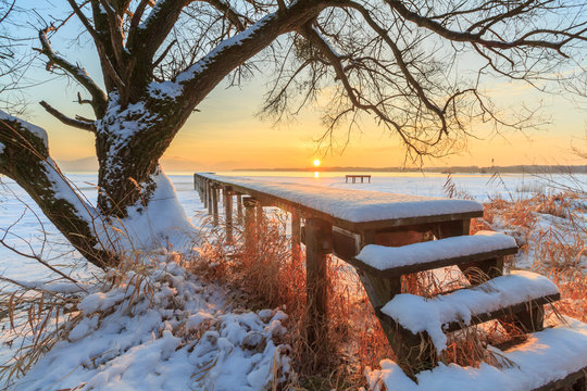 Jetty at Lake Chiemsee in Winter at sunset