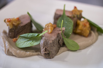 Gourmet dish with lamb and spinach