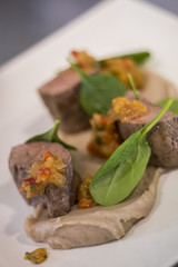 Gourmet dish with lamb and spinach
