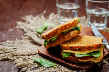 Spinach tomato cheese grilled rye sandwiches