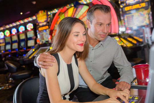 couple playing in casino