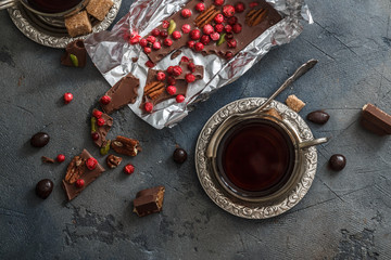 Chocolate with berries and pistachios, top view