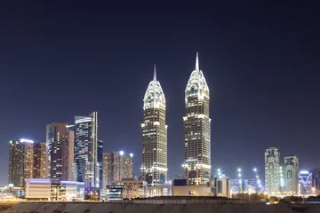 Wandcirkels aluminium Dubai Internet City at night © philipus