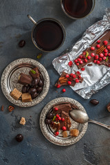 Chocolate with berries and pistachios, top view