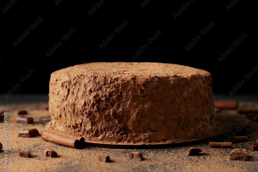 Canvas Prints tasty chocolate cake with cinnamon on black background