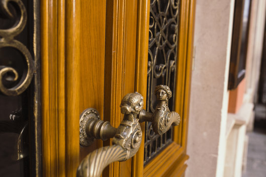 Handle of solid wood door in the centre of Lviv