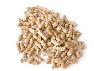 Wood pellets background close up. Isolated in white