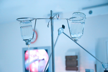 Infusion drip in hospital on blurred background