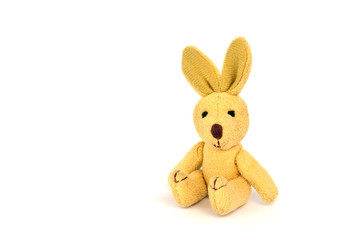 Little brown Plush Rabbit seated looking at the camera