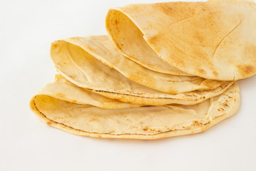 Wheat tortillas on a white background. Closeup