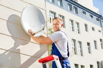Man Fitting TV Satellite Dish