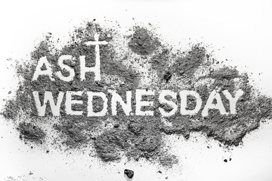 Ash wednesday word written in ash and christian cross symbol