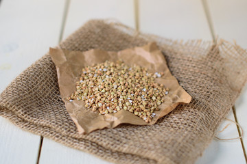 Buckwheat on white wooden background