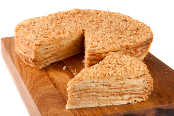 napoleon cake on a cutting board isolated white background