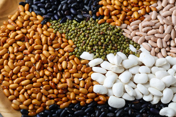 White, black and other beans on plate