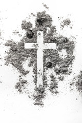 Christian cross made in ash, dust as religion concept background
