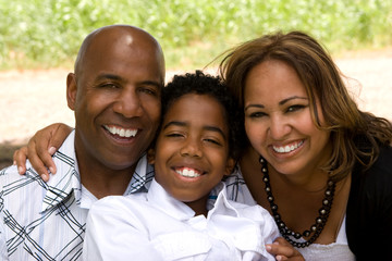 Portrait of happy multicultural family smiling.