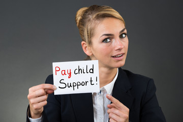 Businesswoman Showing Information On White Card