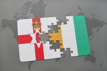 puzzle with the national flag of northern ireland and cote divoire on a world map