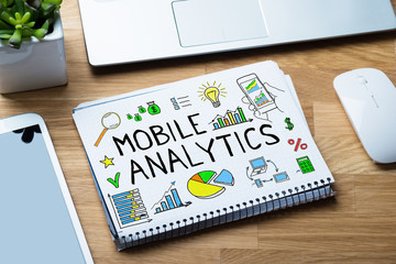 High Angle View Of Mobile Analytic Concept On Binder