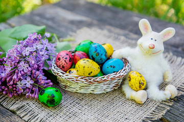 painted Easter eggs with bunny on grass background