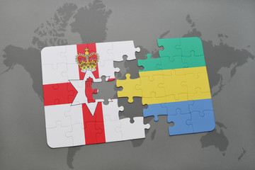 puzzle with the national flag of northern ireland and gabon on a world map