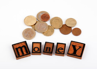 Money. Wooden letters and money on a white background