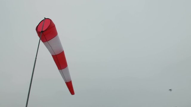 wind sock wave in wind on gray sky background