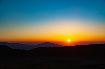 Obraz premium Zachód słońca od Aso