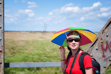 Young woman with umbrella hat