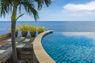 Infinity Pool at a Villa in Bali. An infinity pool looks out over the Lombok Straits on the eastern...