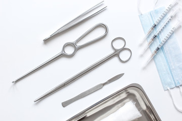 instruments for plastic surgery on white background top view