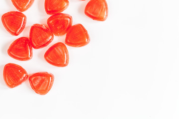 sweets and sugar candies on white background top view