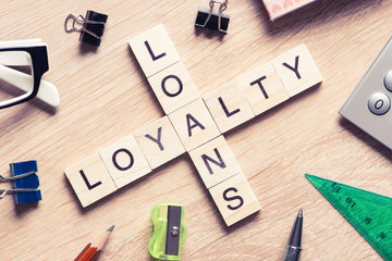 Conceptual business keywords on table with elements of game making crossword