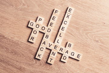 Conceptual business keywords on table with elements of game making crossword
