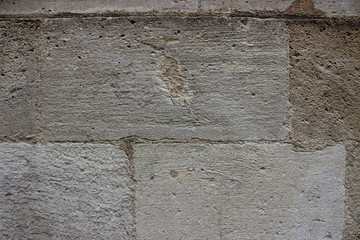 Stone in concrete wall