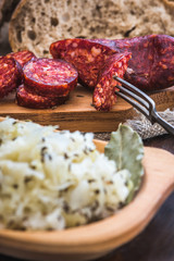Farmer's Breakfast. Sausage, Sour Cabbage and Bread. Raw Ingredients.