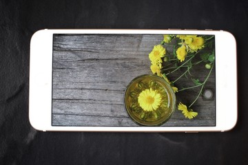 Taking a photo of  chamomile tea with smart phone