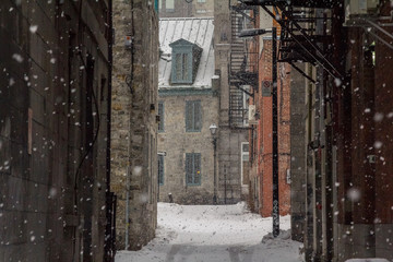 Dead-end in Old-Montreal in winter under the snow. Montreal is the capital city of Quebec, in Canada