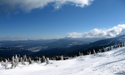 Fototapeta na wymiar Winter landscape of snow-capped peaks, a lot of snow, mountains,