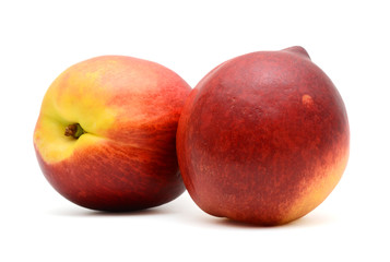 Fototapeta na wymiar two peaches isolated on white background