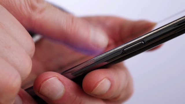 Businessman reading on mobile phone 4 K