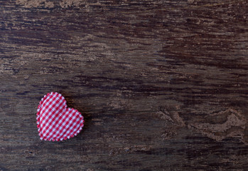 pink hearts placed on the old wooden floor.