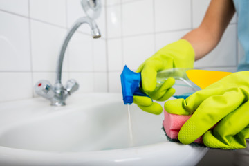 Person Hand Applying Detergent In The Basin